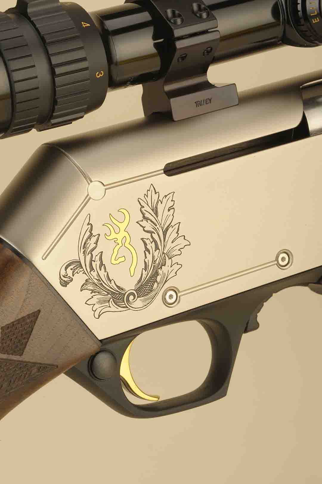 This photo shows the detailing with the MK 3 model with the high relief engraving. The cross bolt safety is standard as well as the gold-plated trigger.